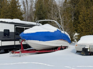 Midwinter, a boat in winter storage protected with shrink wrapping in Mississippi Mills